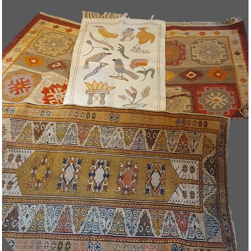 302 - A Turkish woollen rug together with two other rugs