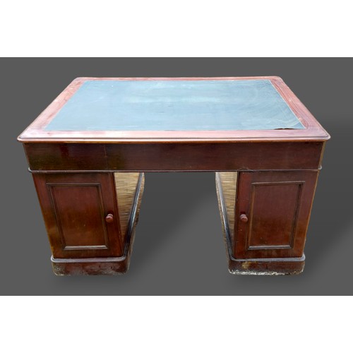 316 - A Victorian mahogany twin pedestal desk, the moulded top above nine drawers with brass handles oppos... 