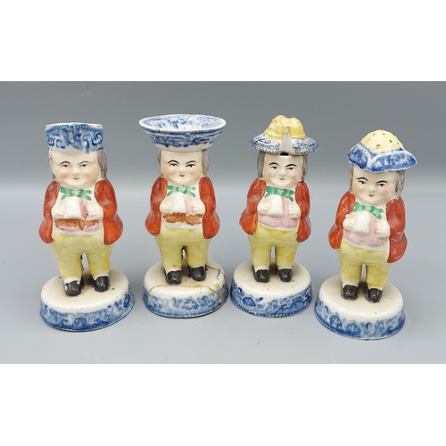 9 - A set of four 19th Century Staffordshire condiments of figural form,13.5cms tall