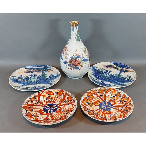 10 - A Japanese Imari bottle neck vase together with two pairs of Japanese Imari plates