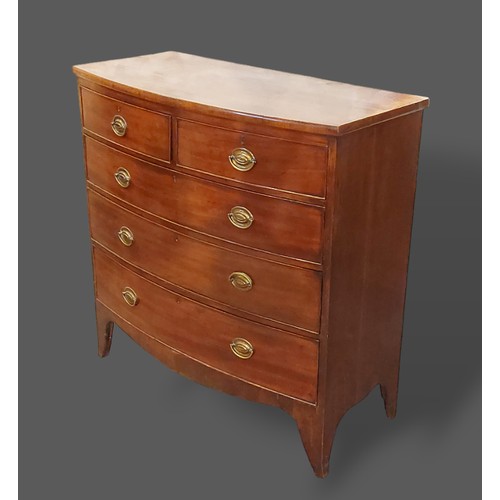 351 - A mahogany bow fronted chest, the moulded top above two short and three long drawers with oval handl... 