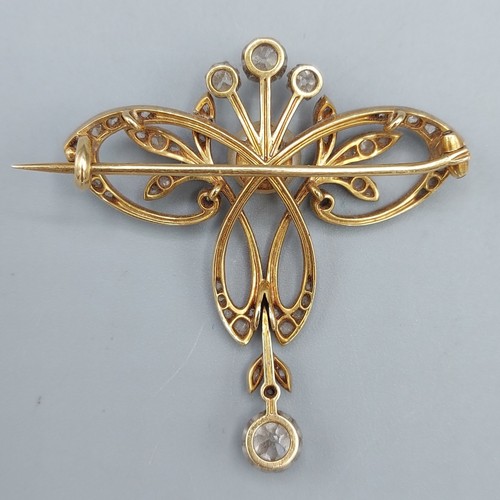 152 - An Edwardian gold, diamond and pearl set brooch/pendant in the form of a bow with a central pearl su... 