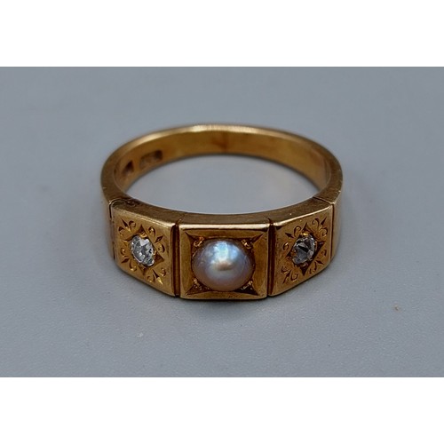 156 - An 18ct gold ring set with a central pearl flanked by two diamonds, 5.6gms, ring size N