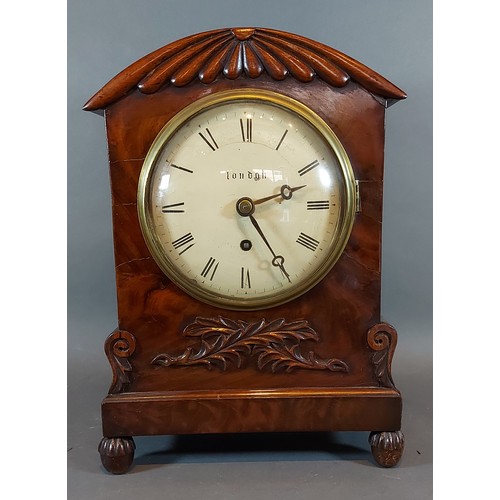 294 - A William IV mahogany cased bracket clock with carved and shaped case,the circular enamel dial inscr... 