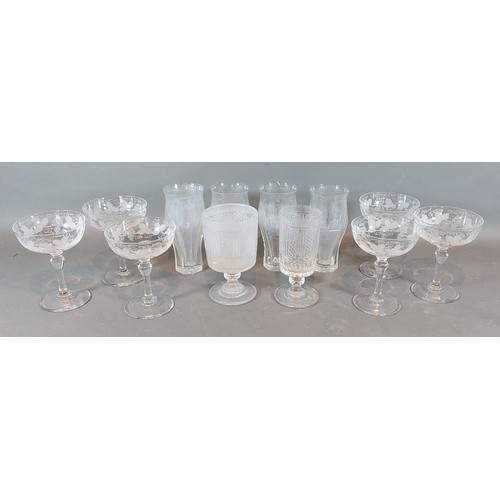 32 - A set of six Champagne glasses with etched decoration, together with other glassware