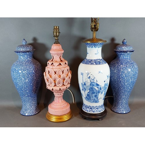 34 - A Chinese style porcelain lamp together with another lamp and a pair of large covered vases