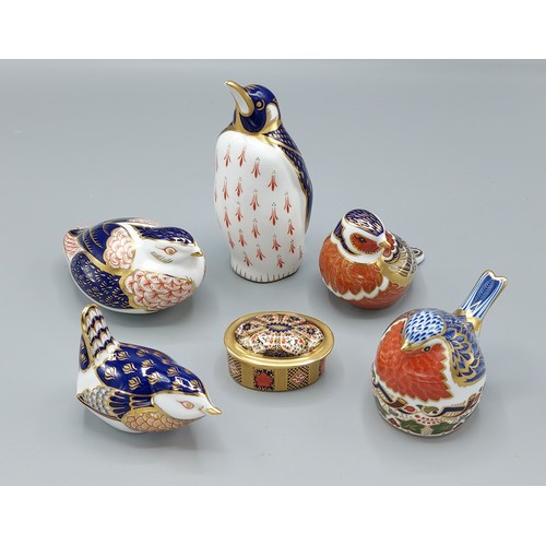 44 - A Royal Crown Derby Emperor Penguin paperweight with gold stopper, together with four other paperwei... 