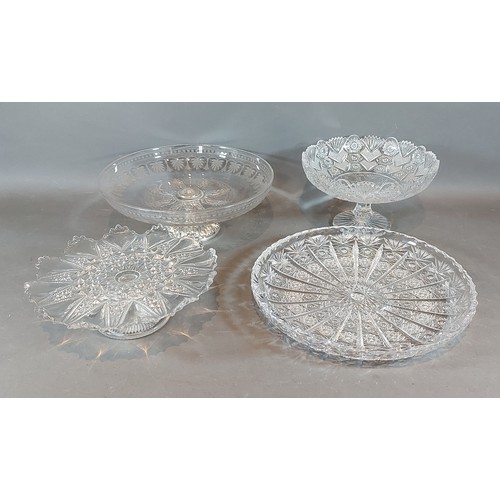 52 - An etched glass and silver plated comport together with two other glass comports and a cut glass dis... 