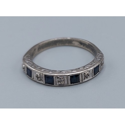 178 - An 18ct white gold Sapphire and Diamond set half eternity ring, ring size M, 3.5gms