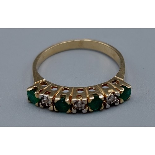 181 - A 14ct gold Emerald and Diamond ring, set with four Emeralds and three Diamonds within a pierced set... 