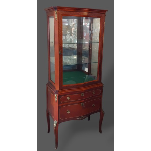 374 - A French kingwood Vitrine with a glazed door enclosing glass shelves, the lower section with two dra... 