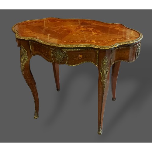 380 - A French marquetry inlaid and gilt metal mounted centre table, the shaped top above a frieze drawer ... 