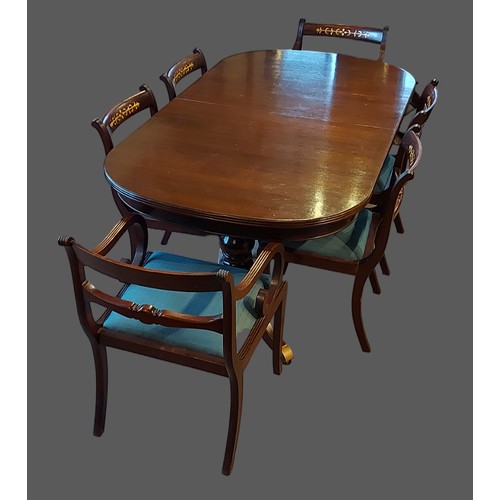 235 - A set of six carved rail back dining chairs, together with a twin pillar extending D end dining tabl... 