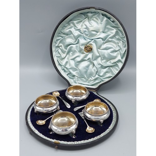 99 - A set of four Victorian silver salts with spoons within a fitted case, London 1893 and 1894, 5ozs