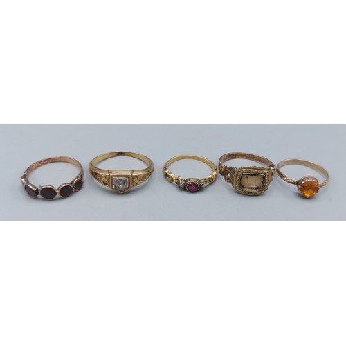 104 - A 19th Century unmarked mourning ring, together with four other unmarked rings, 8.5gms