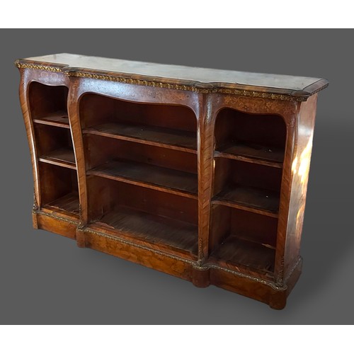 247 - A Victorian walnut, marquetry inlaid and gilt metal mounted bookcase, the moulded top above open she... 