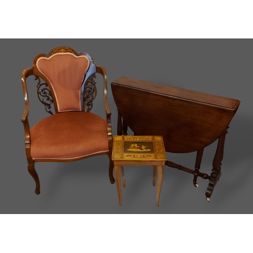 251 - An Edwardian mahogany marquetry inlaid drawing room armchair together with a Victorian Sutherland ta... 