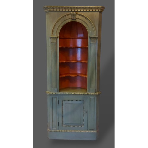 253 - A painted barrel back standing corner cabinet, the moulded cornice above open shelves, the lower sec... 