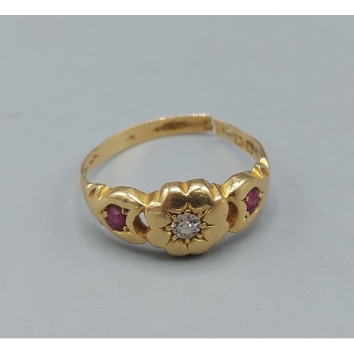 113 - An 18ct gold ring set with central diamond flanked by rubies, ring size O, 2.9gms