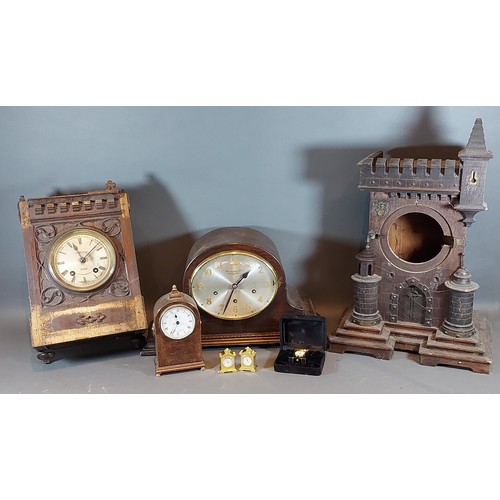 224 - A 19th Century oak Gothic revival mantle clock case together with various other clocks and parts