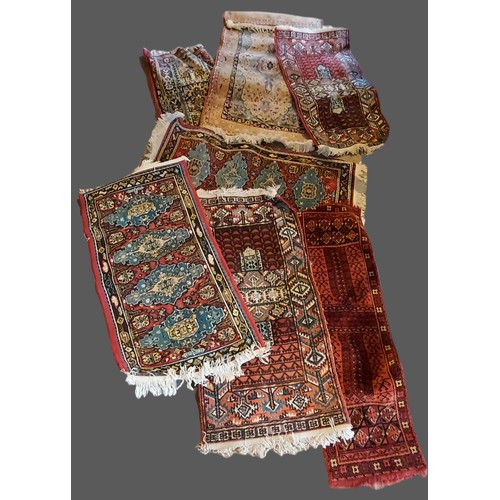 214 - A pair of North West Persian woollen runners, with all over design, 59cms by 112cms, together with  ... 