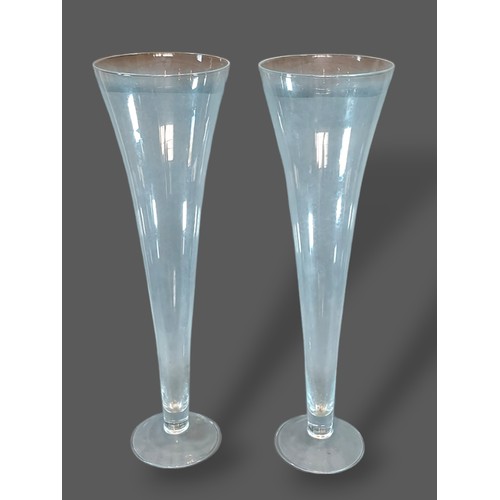 15 - A pair of large glass spill vases of tapering form, 80cms tall