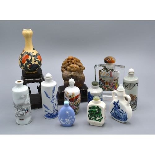 201 - A Chinese Glass Scent Bottle reverse painted with figures and with agate stopper together with vario... 