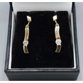 A pair of 18ct gold drop earrings each set with a Diamond, 2.7gms, 2 ...