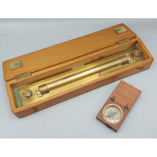 231 - An early 19th Century mahogany cased pocket compass together with a cased brass rolling rule by Lawe... 