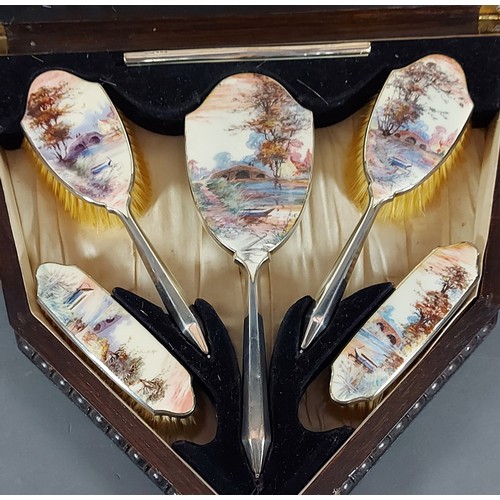 152 - A Birmingham silver and enamel decorated five piece dressing table set in fitted oak case