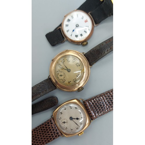 167 - A 9ct gold cased wristwatch with leather strap together with two other 9ct gold cased wristwatches