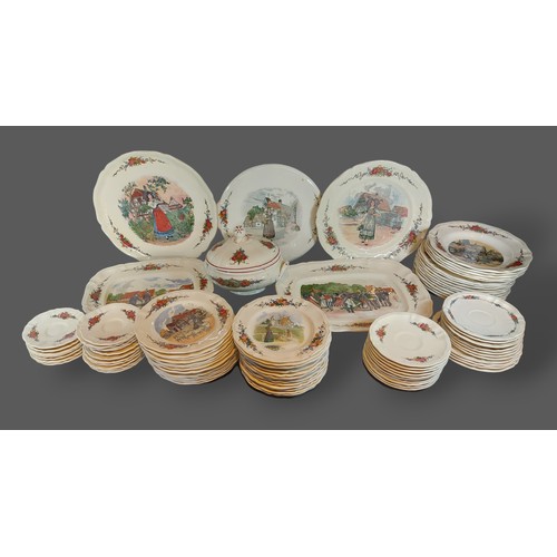 29 - A Sarreguemines dinner and tea service comprising plates, cups and saucers and related