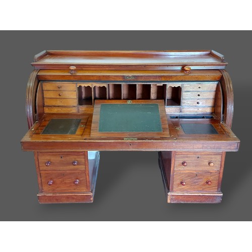 347 - A Victorian mahogany twin pedestal cylinder desk, the fitted top above six drawers with knob handles... 