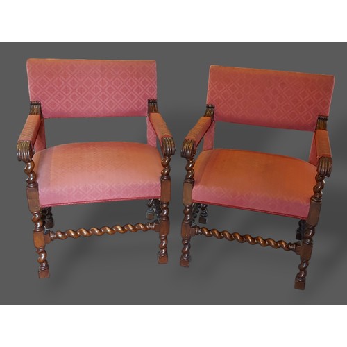 360 - A pair of 19th Century armchairs, each with an upholstered back and seat with barley twist legs and ... 