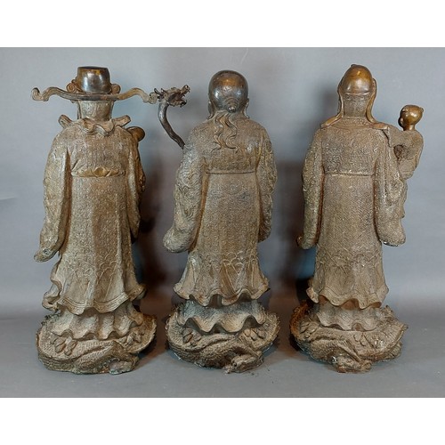 224 - A group of three Chinese patinated bronze figures, Sanxing Divine Immortals, 51cms tall