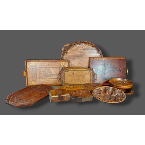 291 - A group of four carved moulds together with other items to include driftwood