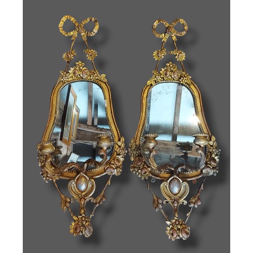 371 - A pair of gilded Girandole of shaped form, each with a bow cresting, 82cms x 35cms