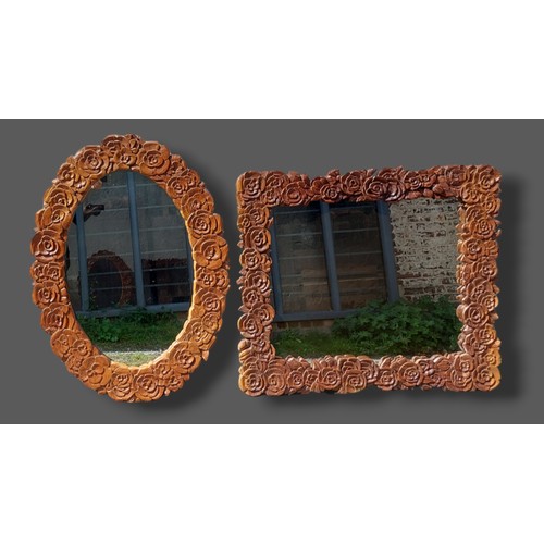 373 - A large rectangular wall mirror carved with flower heads, 98cms x 111cms together with another simil... 