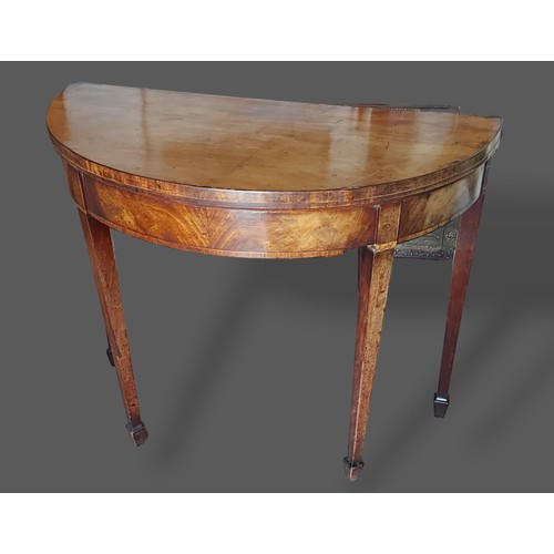 390 - A 19th Century mahogany card table, the hinged top with baize lined interior raised upon square tape... 