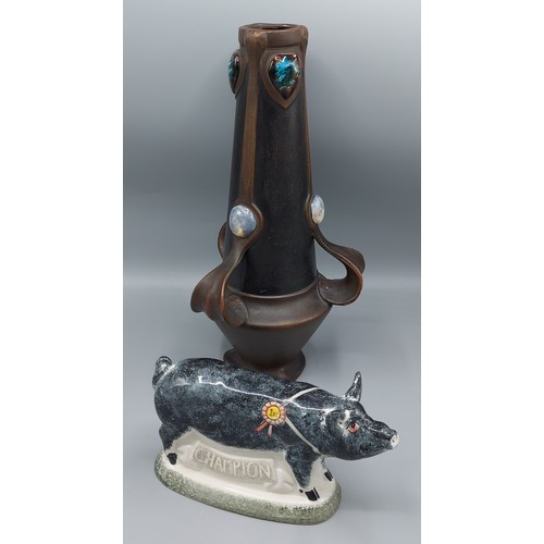 57 - A Bretby art pottery vase of tapering form with three shaped handles and decorated with Ruskin style... 