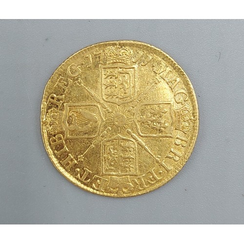 152 - A Queen Anne Gold Guinea, dated 1711, third bust, 8.2gms, 2.5cms diameter