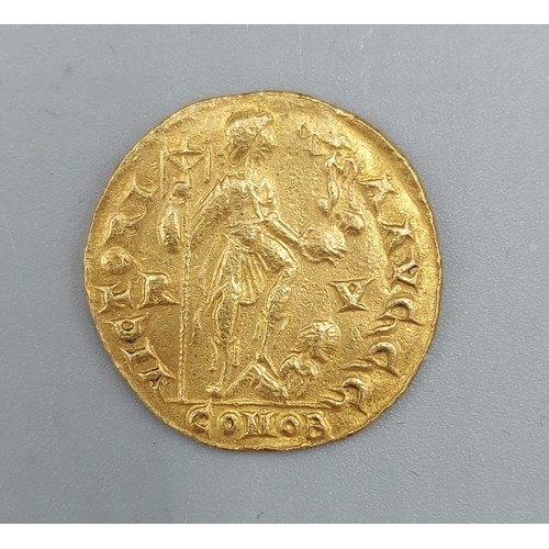 181 - A Roman Gold Solidus of emperor Honorius, 4.3gms, 2cms diameter