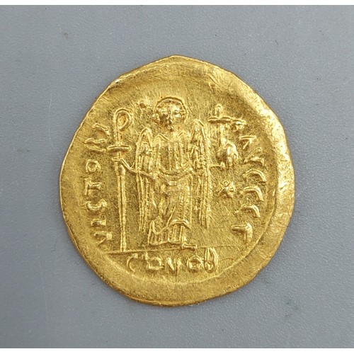 182 - A Roman Gold Solidus, Justinian I, 4.4gms, 2cms diameter