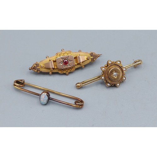 57 - A 9ct gold bar brooch with a central Ruby surrounded by Diamonds together with another bar brooch wi... 