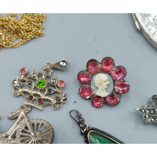 77 - A collection of mainly silver jewellery to include brooches, bracelets and related