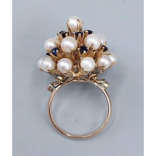 94 - An 18ct gold cluster ring set with Pearls and Sapphires, 9.2gms, ring size O