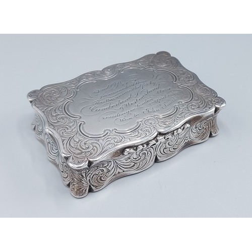 107 - A Victorian presentation silver snuff box, the hinged cover enclosing a silver gilt interior, Birmin... 