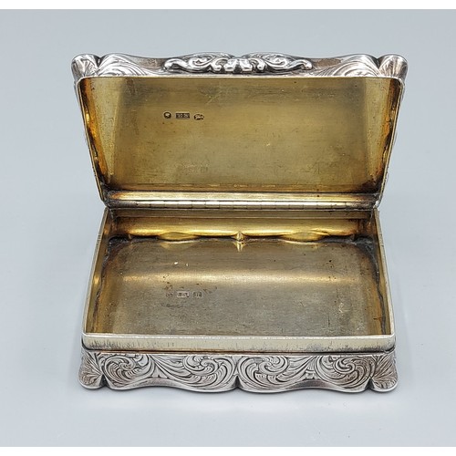 107 - A Victorian presentation silver snuff box, the hinged cover enclosing a silver gilt interior, Birmin... 