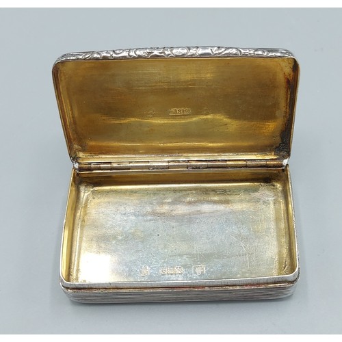 108 - A George IV silver snuff box, the hinged cover enclosing a silver gilt interior, Birmingham 1829, ma... 