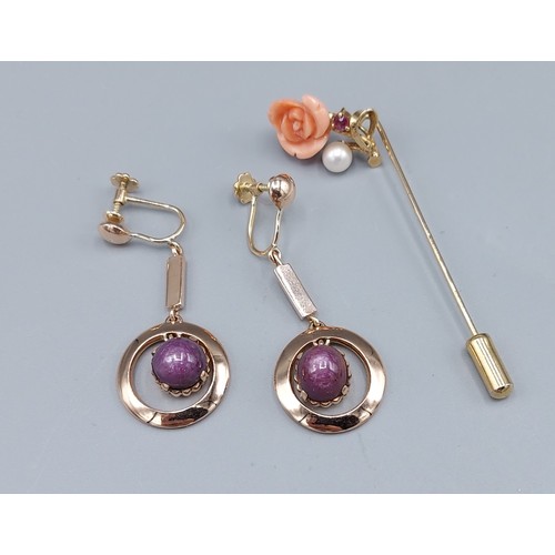 114 - A 14ct gold stickpin set with a Coral flowerhead, Pearl and Amethyst and a pair of tested gold drop ... 